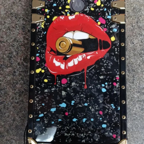 A Motorola G Play phone with case